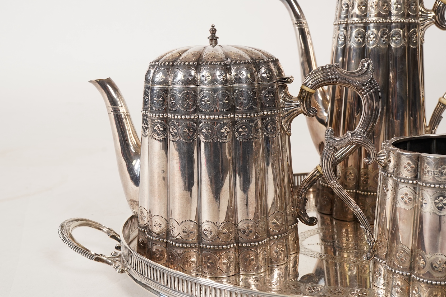 A late Victorian five piece silver tea and coffee service, all pieces with makers marks for John Edward Bingham and Walker & Hall